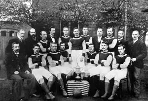The Aston Villa team that won the FA Cup, posing with the trophy.