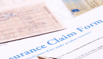 Close-up of an insurance claim form and pen.